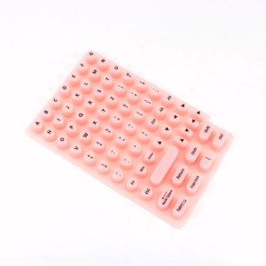 Pink heart-shaped keyboard cover for long nails, offering comfort and protection