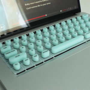 Keyfit 002 green keyboard cover for long nails, on a MacBook.