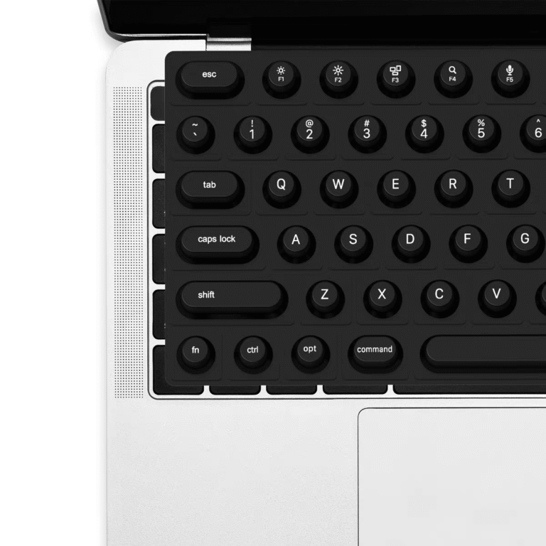 Close-up of black nail-friendly keyboard cover on MacBook